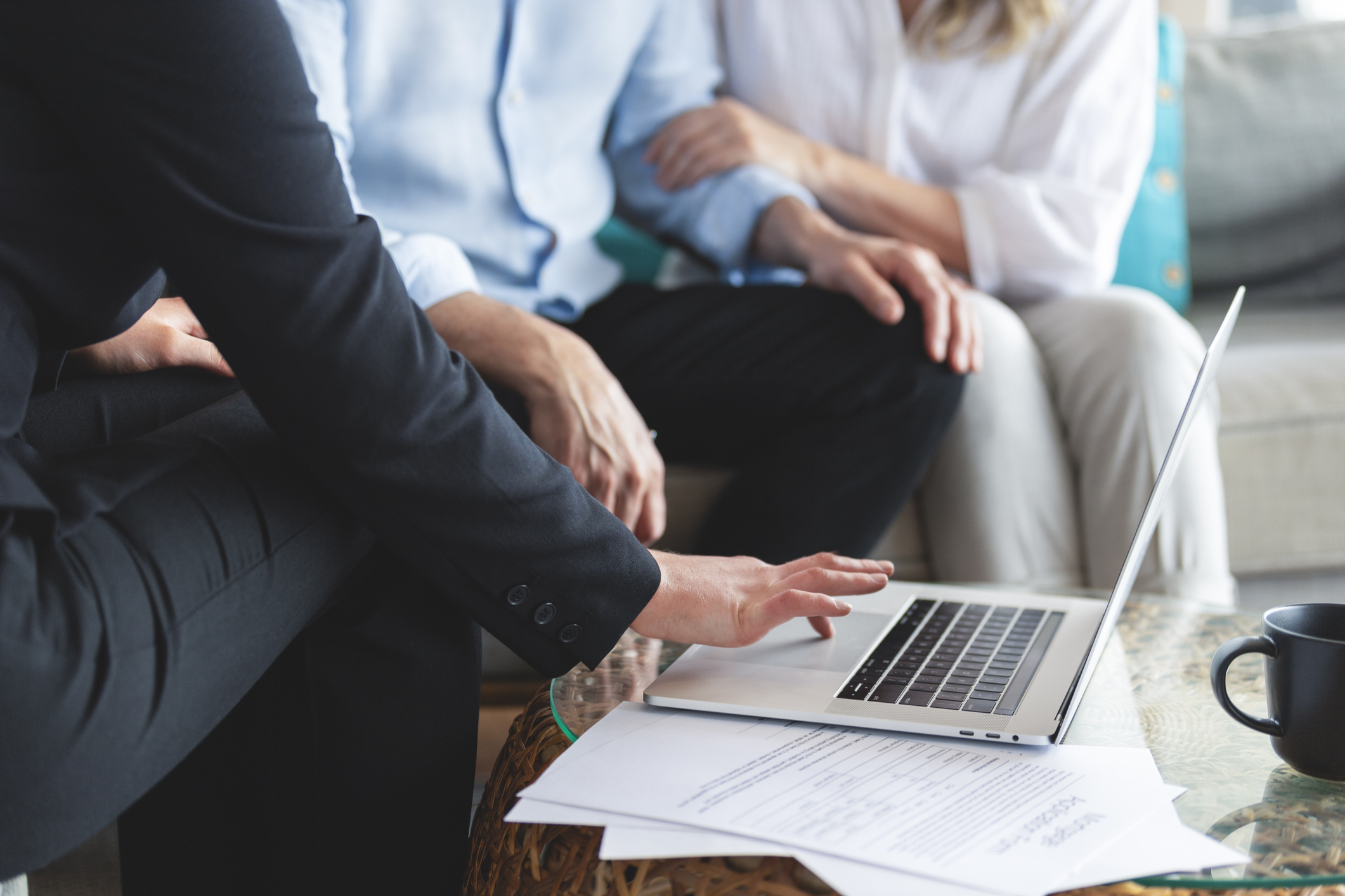 Image of lawyer assisting a couple. 